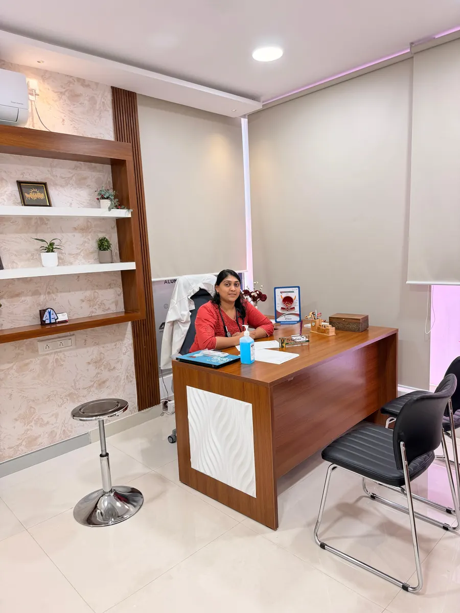 Dr. Vyshnavi T S seated at her desk in the consultation room