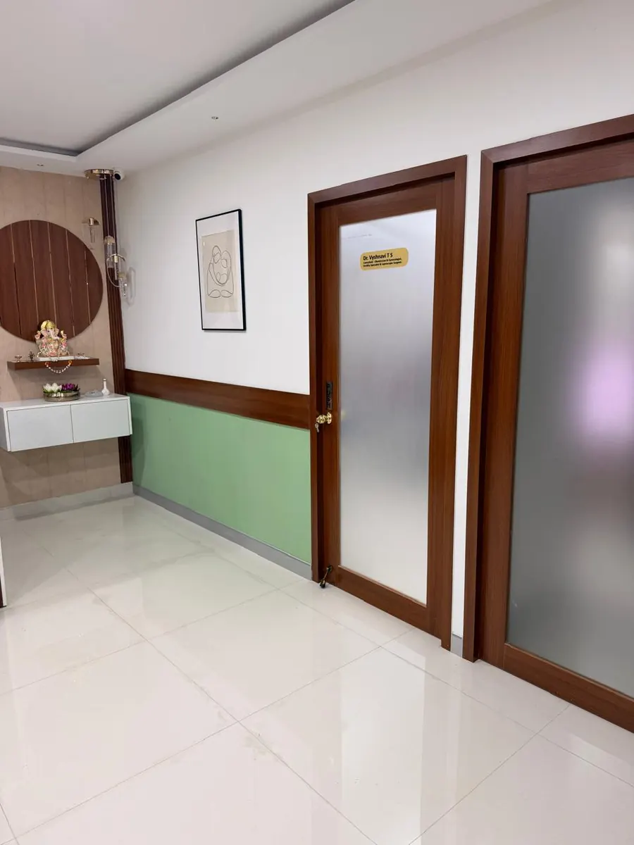 A corridor with frosted-glass doors to the consultation rooms